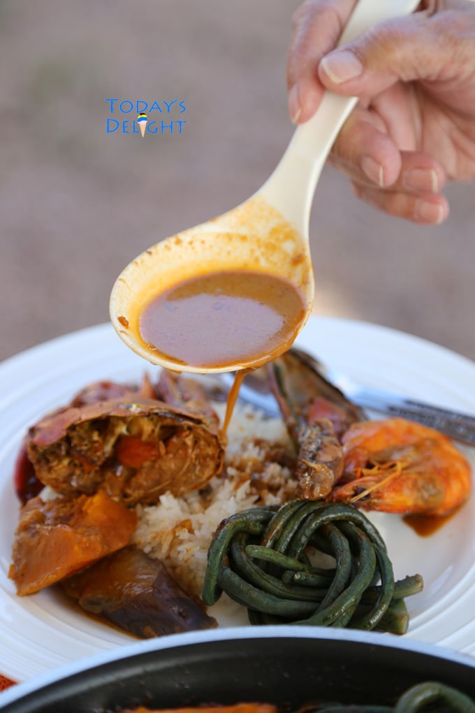 Crab, mussel, shrimp, green beans, kabocha squash, eggplant and sauce poured over white rice.