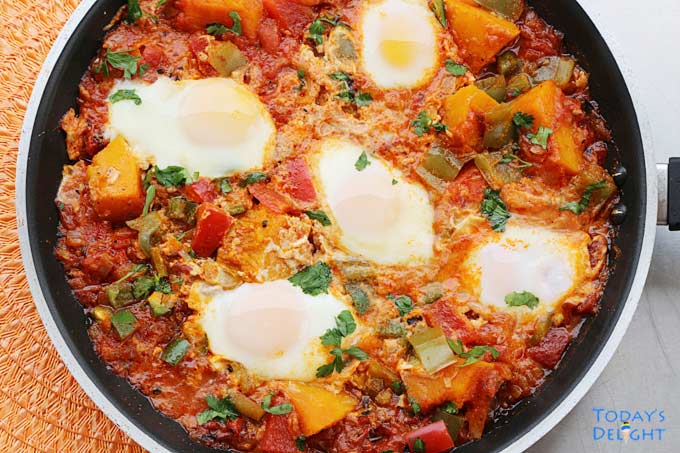Cooked and creamy Kabocha Squash Shakshuka in a pan.