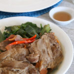 Sinigang na Baboy sa Bayabas in bowl is a Filipino soup with pork and vegetables.