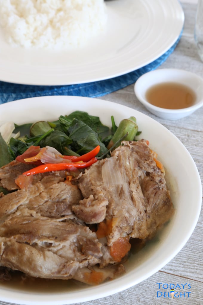 Sinigang na Baboy sa Bayabas in bowl is a Filipino soup with pork and vegetables.