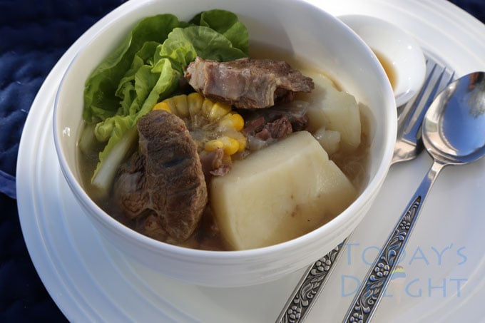 Bulalo soup in a bowl with a side of fish sauce.