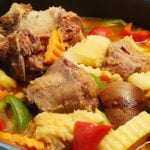 Oxtail tripe callos stew with garbanzos, potatoes, green and red pepper in sauce.