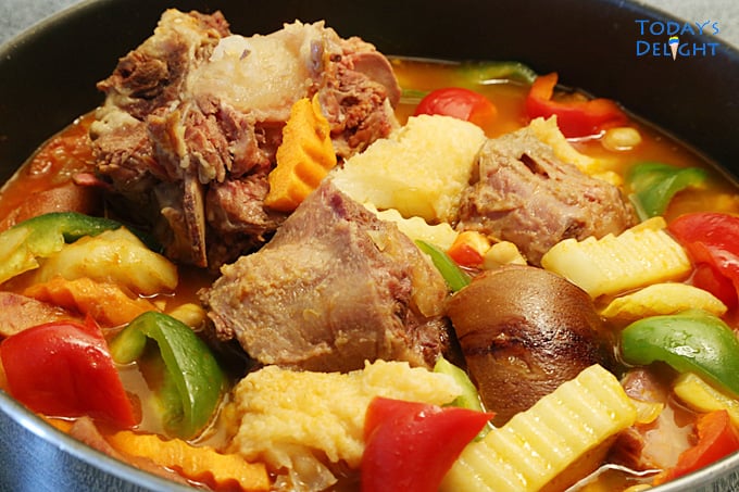 Oxtail tripe callos stew with garbanzos, potatoes, green and red pepper in sauce.