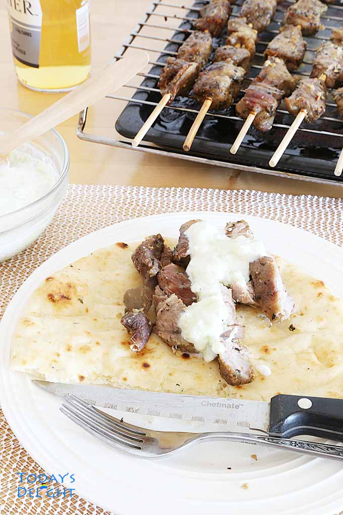 Greek Pork Souvlaki with pita bread and Tzatziki sauce.