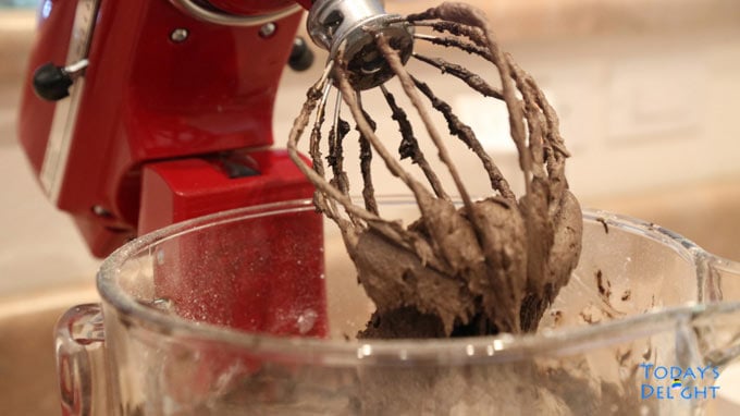 Make chocolate cake frosting in mixer.