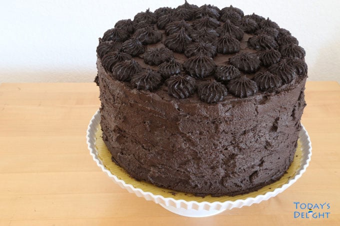 Easy moist chocolate cake in cake stand.
