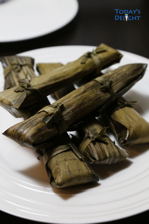 Cassava Dessert wrapped in banana leaves is Today's Delight.