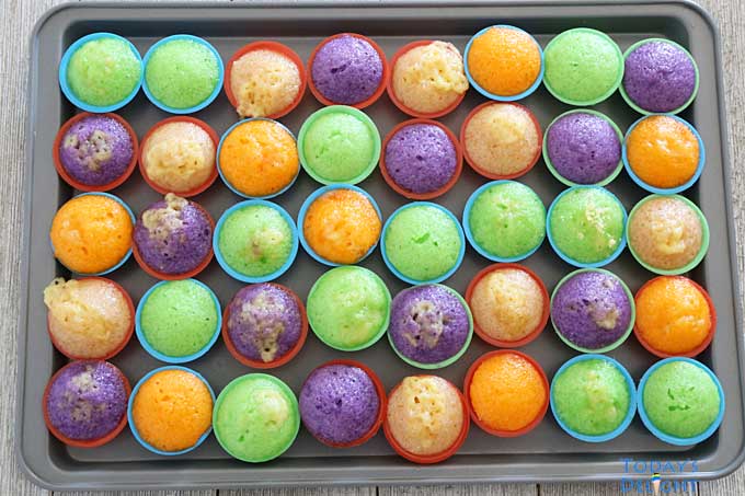 Bite-sized rice cakes topped with cheese in molds.