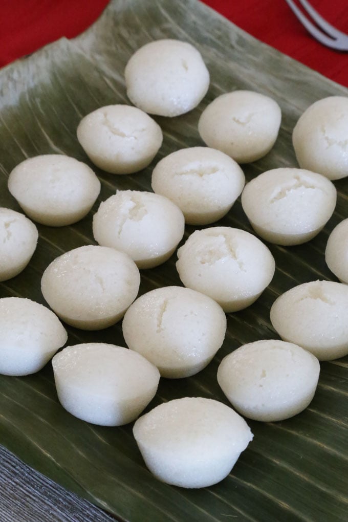 White rice cakes called puto calasiao on a banana leaves.