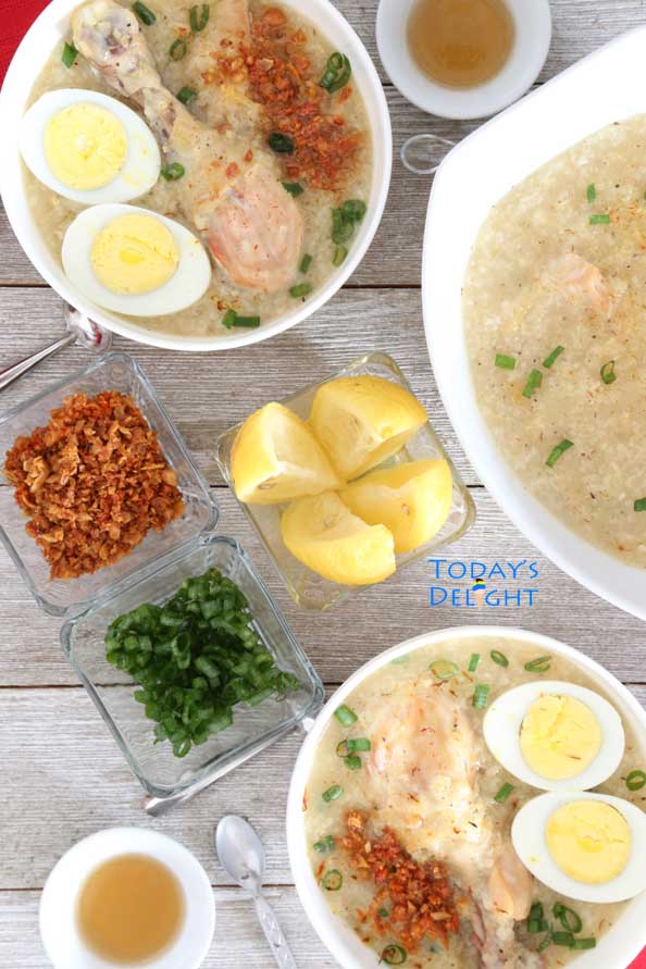 Arroz Caldo is a porridge made with chicken, hard-boiled egg sprinkled with toasted garlic and green onion seasoned with lemon and fish sauce.