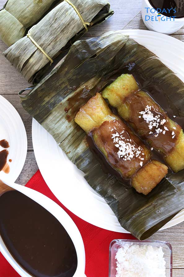 Suman sa Lihiya, a Filipino sticky rice dessert with coconut caramel sauce and grated coconut.