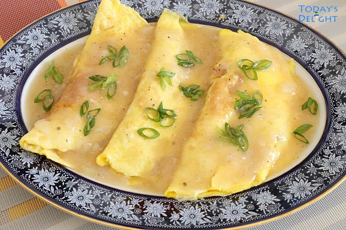 Sayote Omelette with Pork and Shrimp with gravy, garnished with green onion - Filipino Lent Food Ideas.