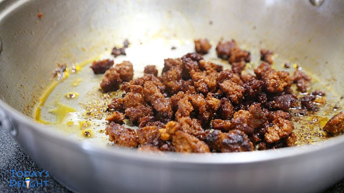 Spicy chorizo cooking in pan