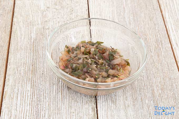 Champagne vinegar, white wine, shallots, tarragon leaves, salt, and pepper in a small bowl to make vinegar reduction.