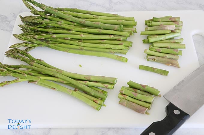 Trim woody ends from asparagus.