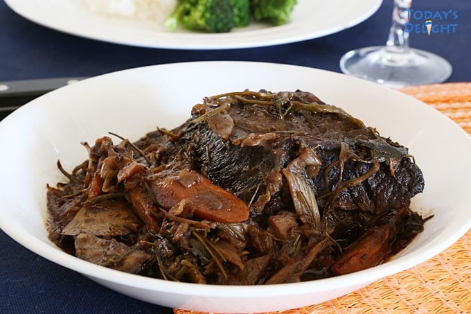 Braised Beef Short Ribs in Red Wine Sauce in a serving plate