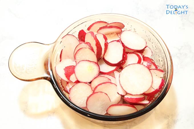 Slice red radish sprinkle with salt in a small bowl.
