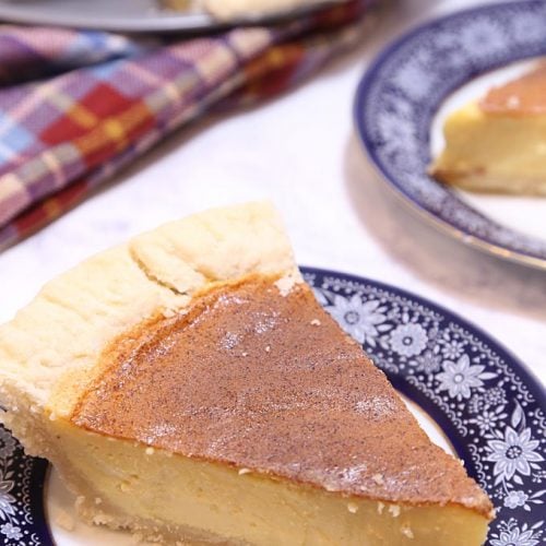 A slice of Eggnog Custard Pie on a plate is Today's Delight.