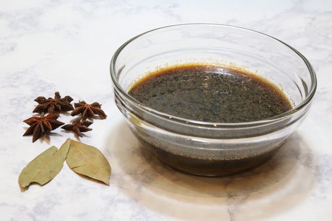Brown sauce, star anise & bay leaves to make pata tim.