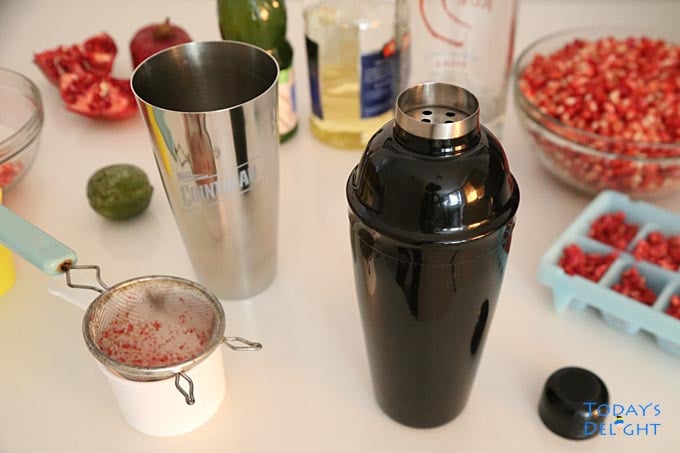 Strain pomegranate juice from seeds.
