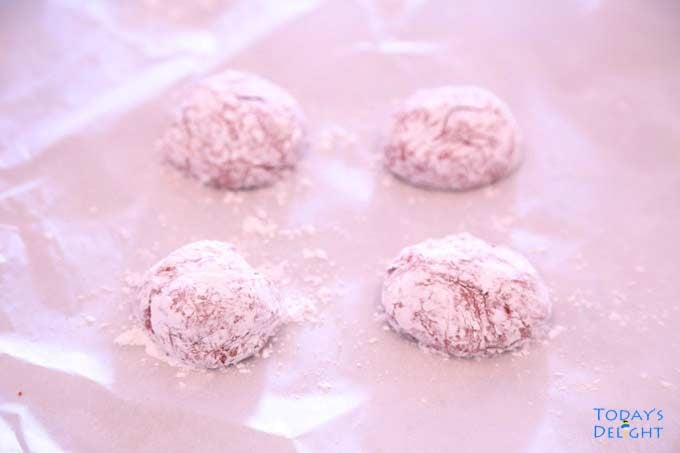 Dough formed into a ball & coated with powdered sugar.