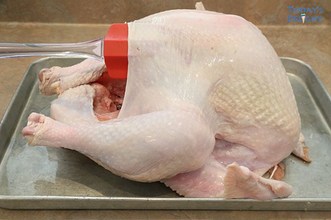 Loosen turkey skin with spatula.