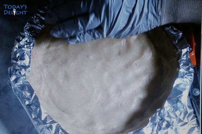 Homemade pie crust edges covered with foil.