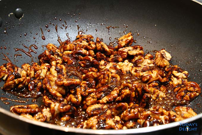 Halves walnuts mixed with caramelized sugar.