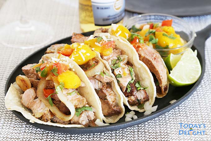 Pork tacos with mango salsa & beer.