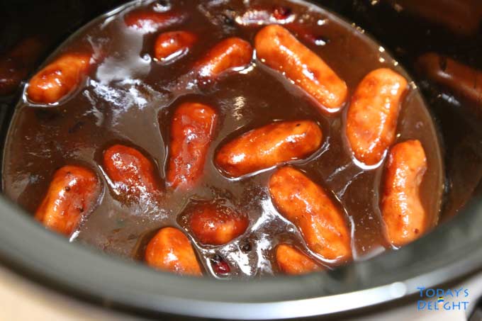 Smokies ingredients in a crock pot.