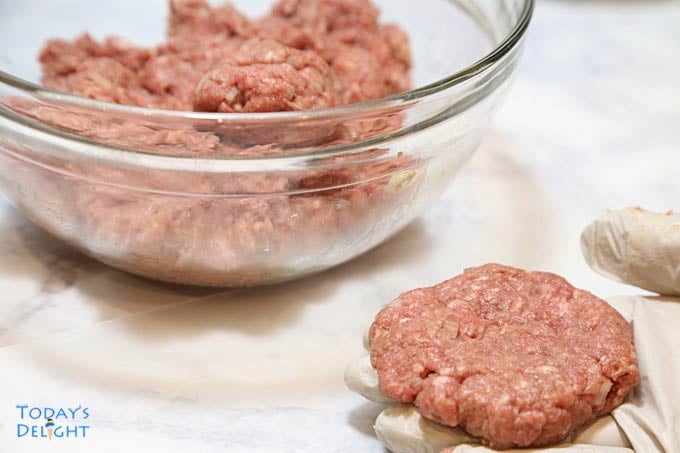 Flattened burger mixture.