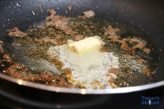 Butter melted in pan with fond.