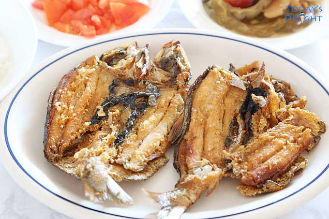 Crispy Fried Bangus (Milkfish) with veggie sides.