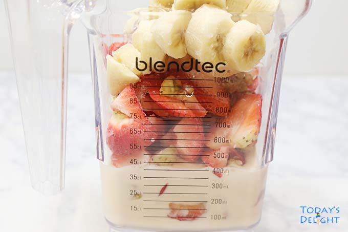 Strawberries, banana, Greek yogurt and milk in the blender.