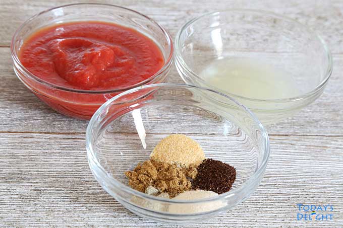 Three small bowls of tomato sauce, seasonings, and lime juice.