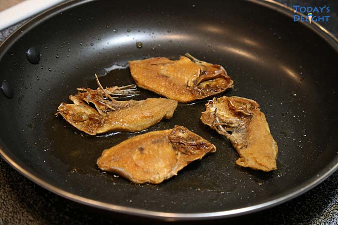 Crisp danggit fish in frying pan.