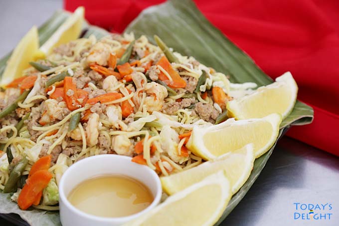 Serve pancit canton with lemon, soy sauce or fish sauce.