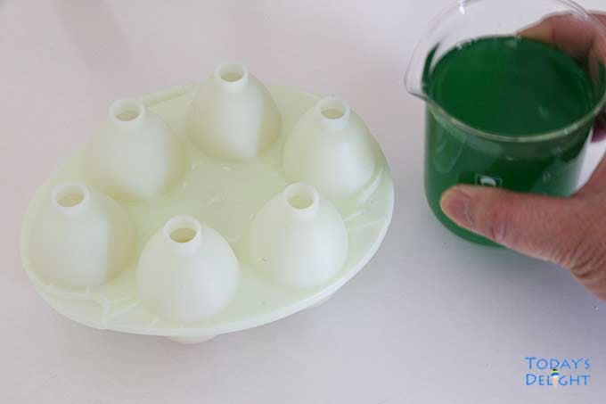 Ready to pour green gelatin mixture into 6 egg molds.
