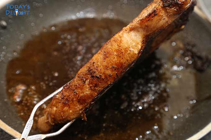 Steak edges fried in a pan.