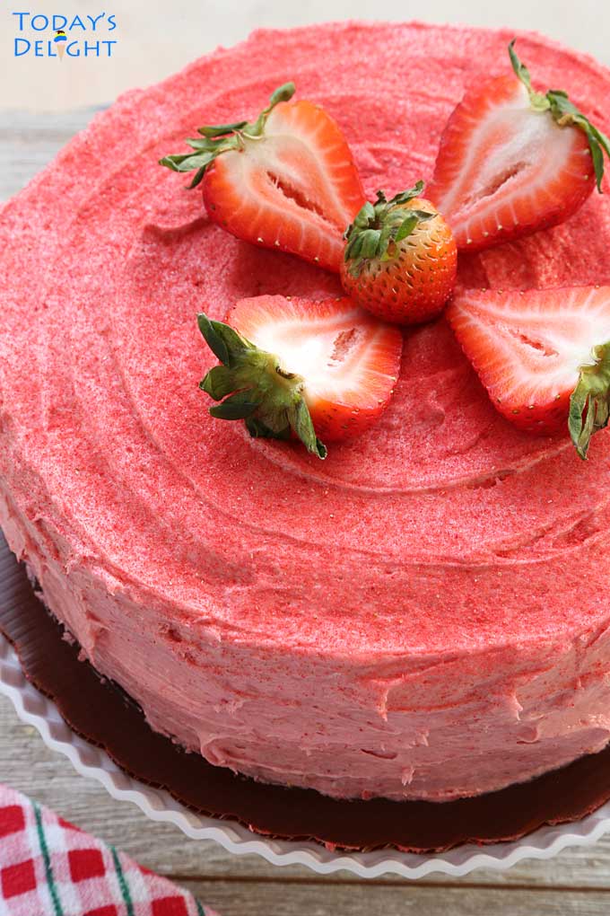 Strawberry cake decorated with large sweet fresh strawberries.