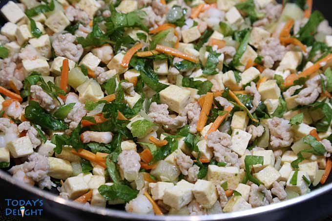 Ingredients for tofu veggie stir-fry in skillet.