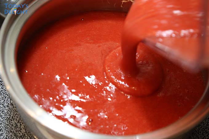 Pureed strawberries poured in a sauce pan.