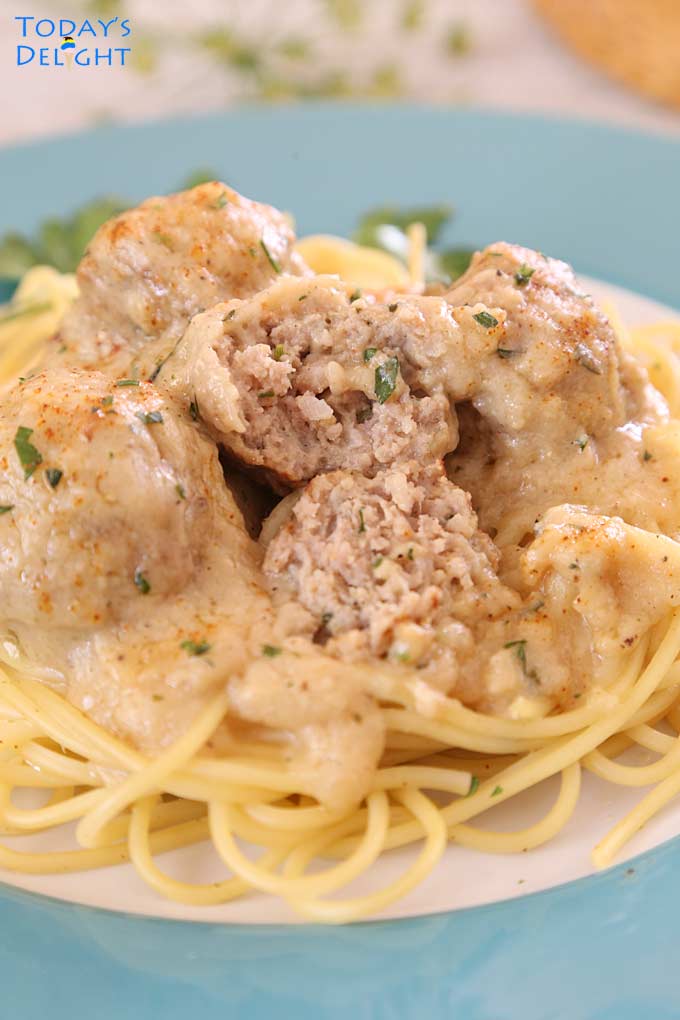 A bite in these juicy tender meatballs over pasta.