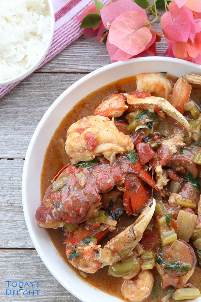Creole gumbo in a bowl and a side of white rice.