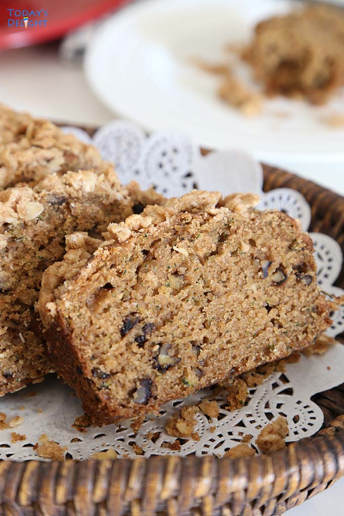 Sliced pumpkin bread on a tray with liner.