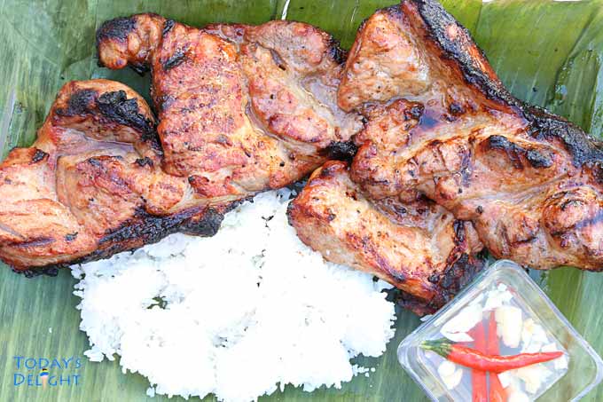 Filipino barbecue with rice and vinegar dip.