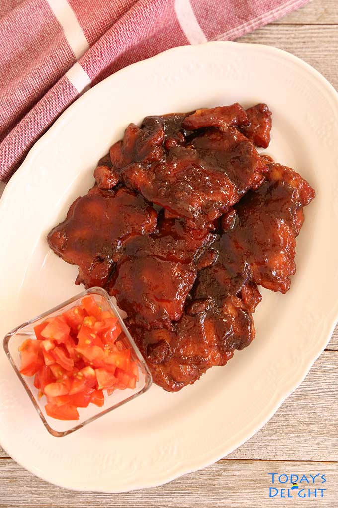 Cured meat with cubed tomatotes.