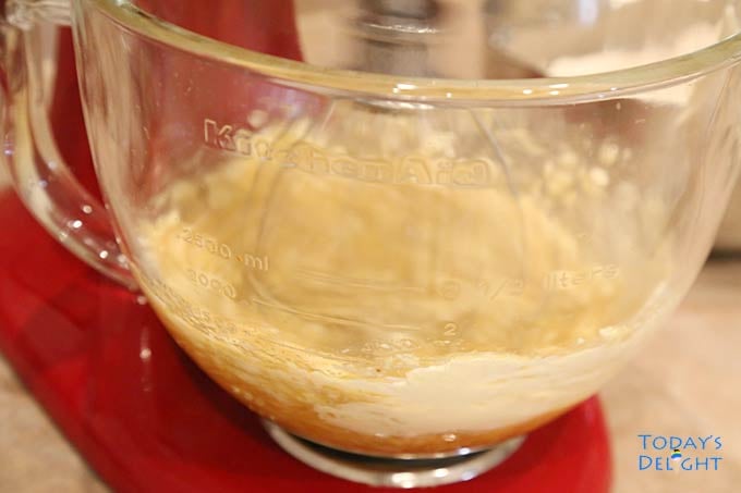 Dough ingredients whisk in a stand mixer.