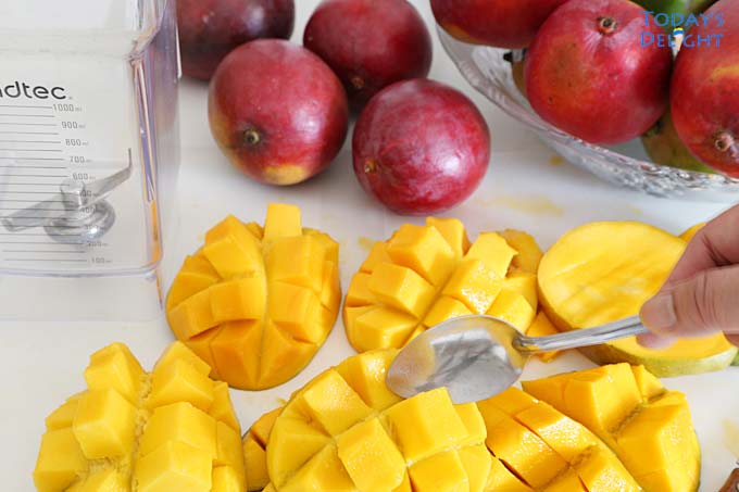 Scoop out mango flesh.