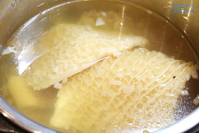 Cooked tripe picks up the color of spices.